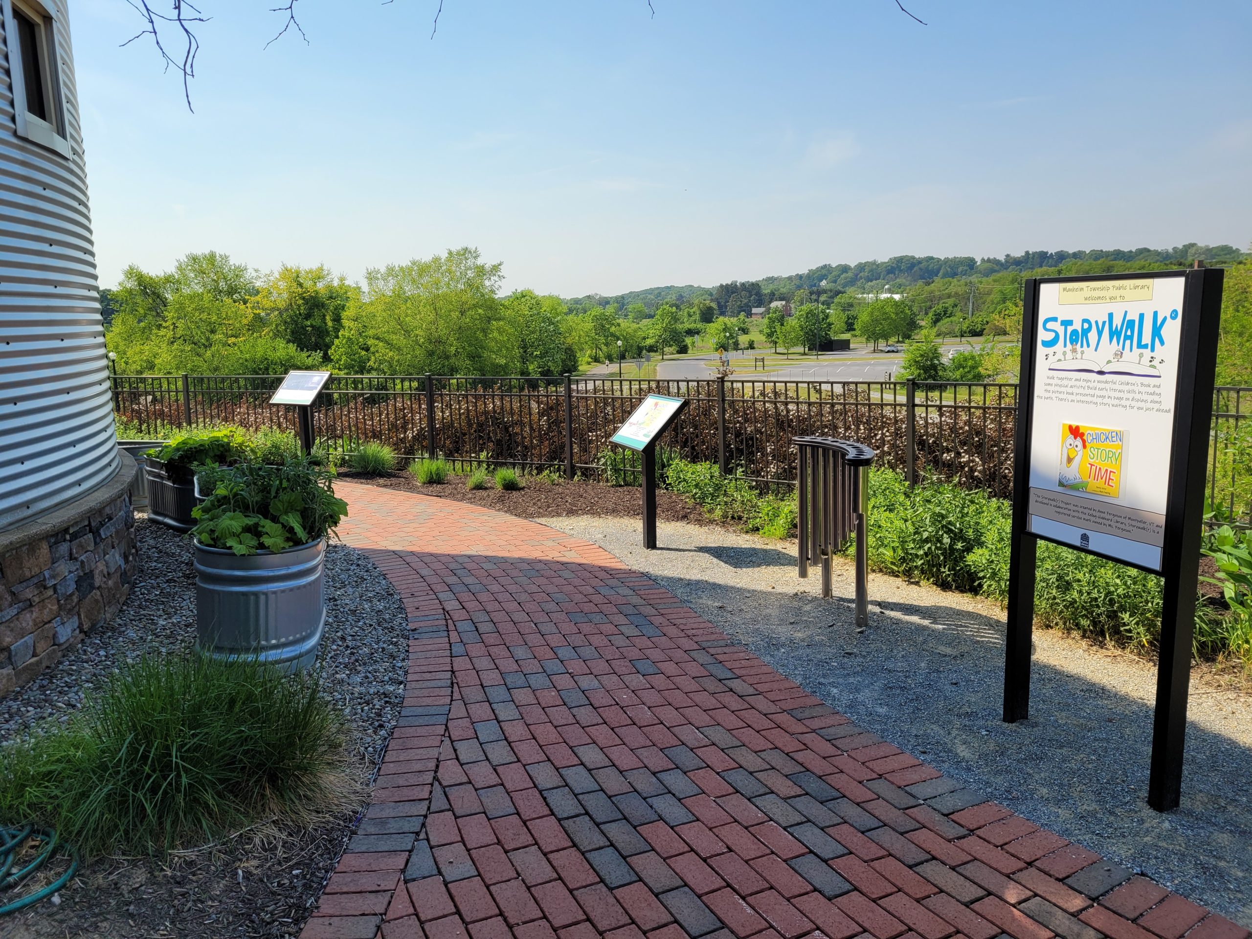 Image of the Discovery Patio featuring the Library's StoryWalk®